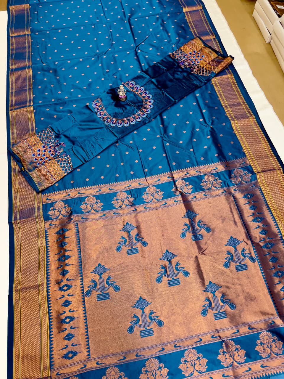 The beautiful traditional Paithani pallu enhances its royal appeal, while the exclusive designer running blouse piece completes the look. Perfect for weddings, festive celebrations, cultural events, and special occasions.