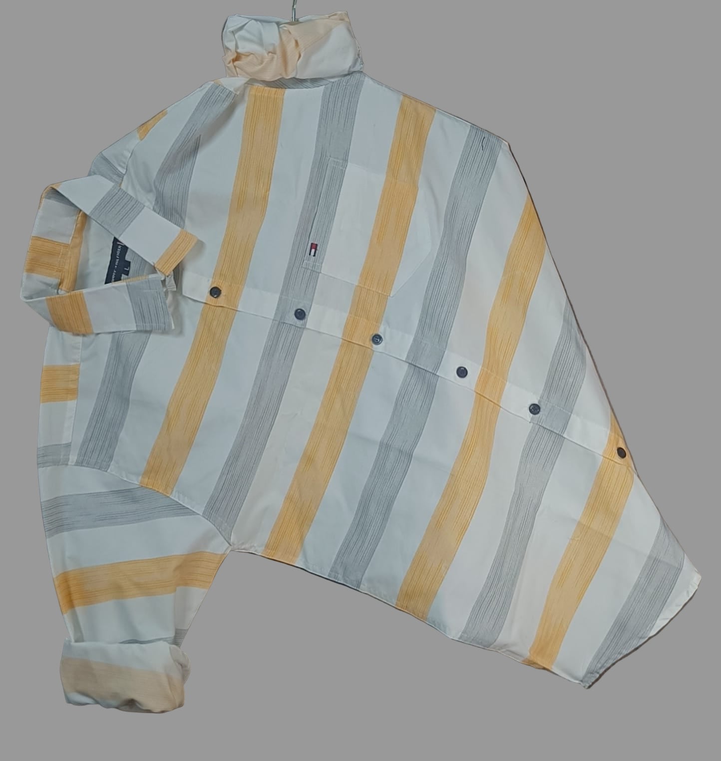 Tommy Hilfiger Cotton Premium Regular Fit Lining Shirt – Stylish full sleeve lining shirt crafted in breathable cotton. Perfect for casual and office wear, available in Yellow &amp; Green. Sizes: M, L, XL.