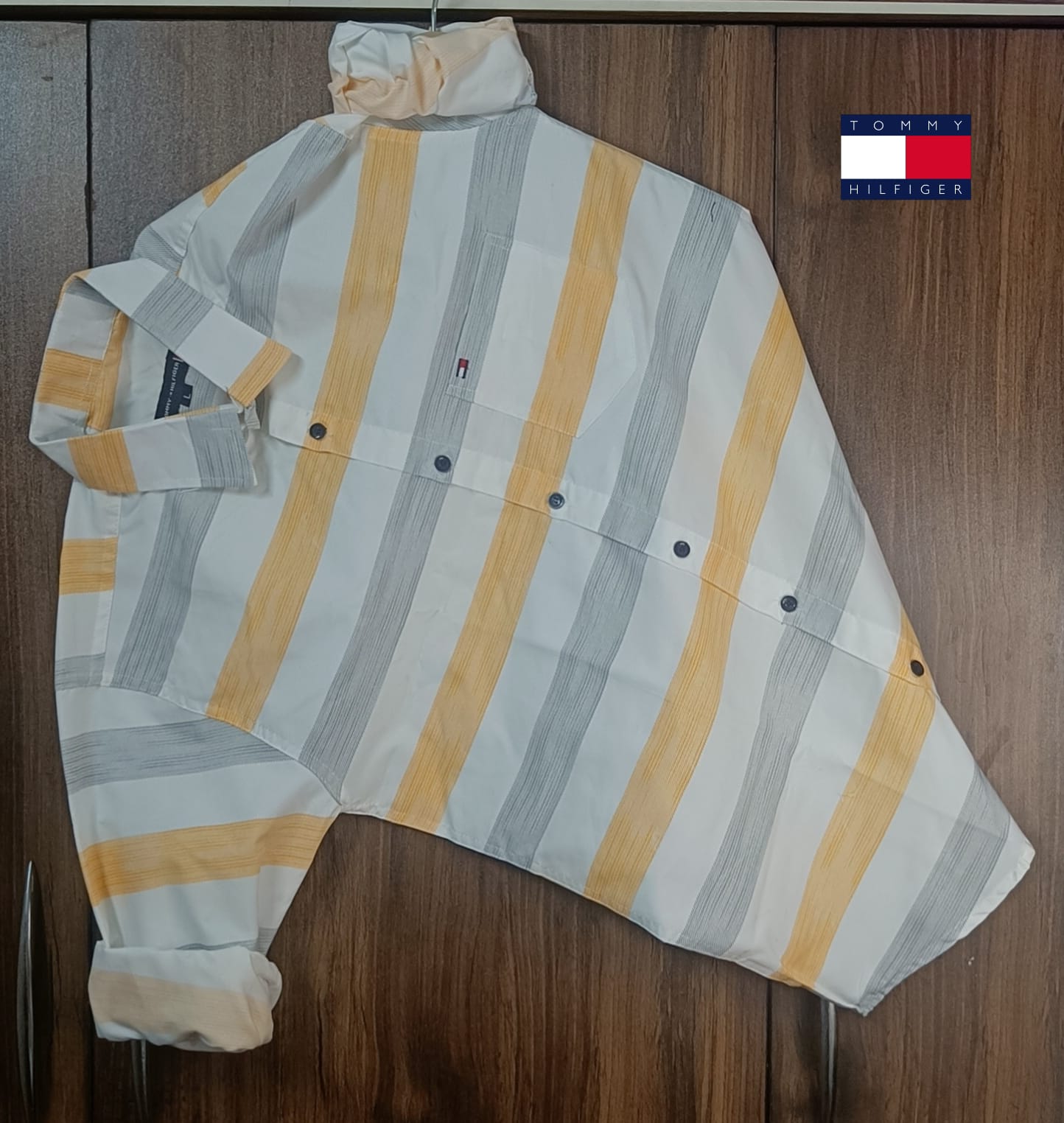 Tommy Hilfiger Cotton Premium Regular Fit Lining Shirt – Stylish full sleeve lining shirt crafted in breathable cotton. Perfect for casual and office wear, available in Yellow &amp; Green. Sizes: M, L, XL.