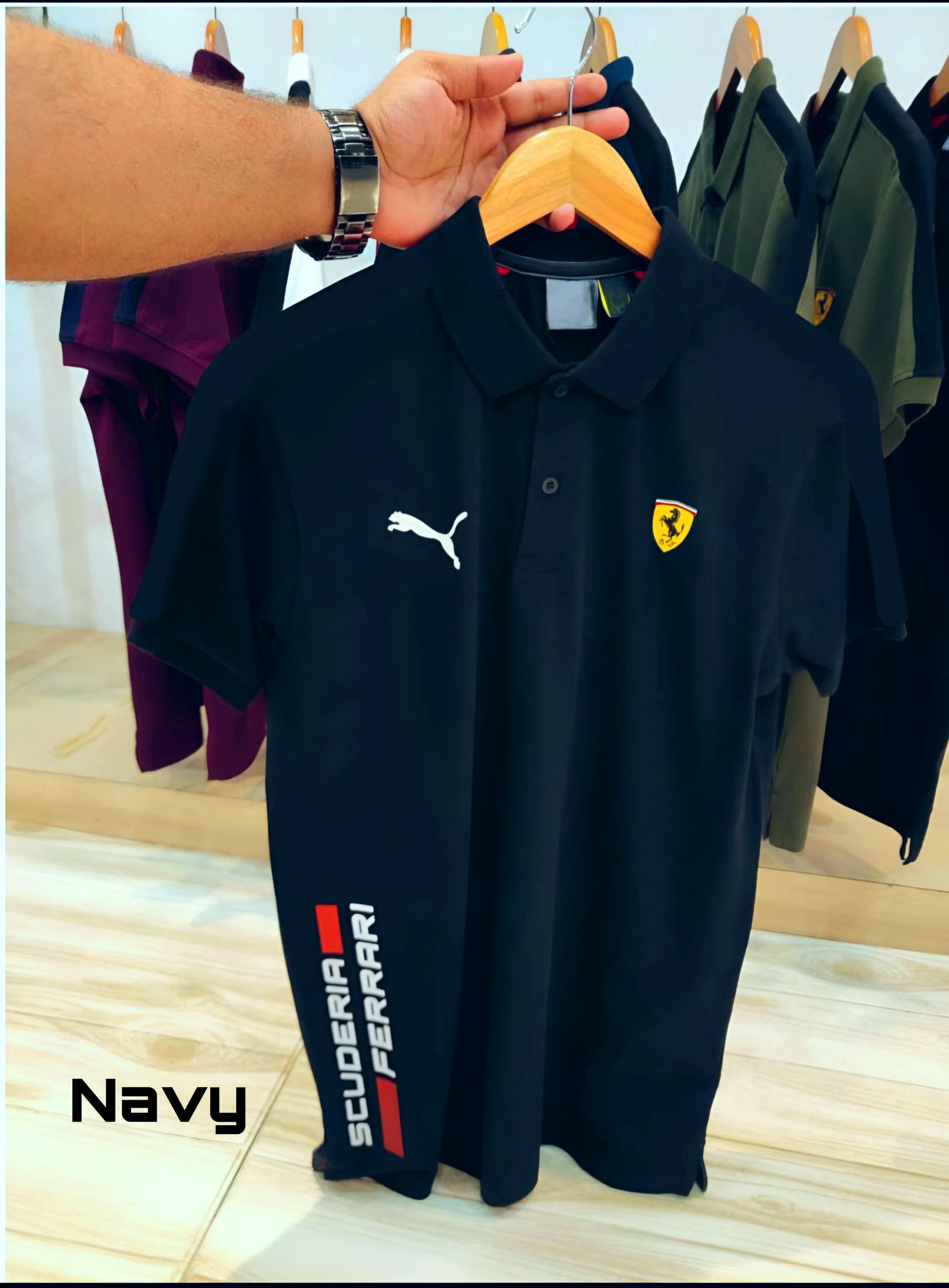 Experience sporty elegance with the Puma Ferrari Premium Matty Cotton Collar T-Shirt for Men. Crafted from 100% SAPP Matty Cotton, this tee combines comfort, durability, and iconic style. Featuring a structured collar, sleek finish, and official Puma x Ferrari branding, it’s designed to give you that effortlessly smart look – whether you're heading out or dressing casual. Choose from 4 bold colors and make every outing a style statement.