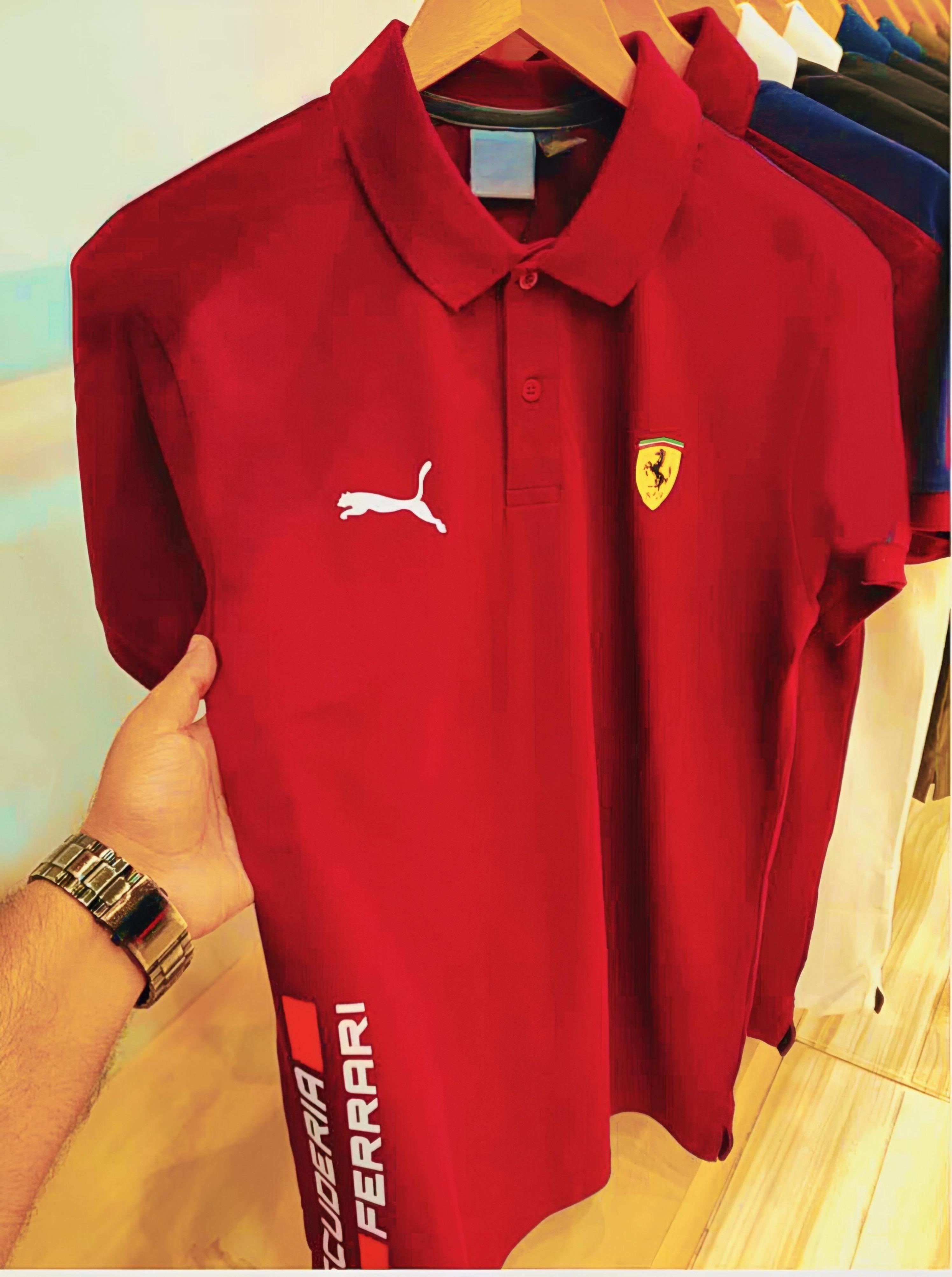 Experience sporty elegance with the Puma Ferrari Premium Matty Cotton Collar T-Shirt for Men. Crafted from 100% SAPP Matty Cotton, this tee combines comfort, durability, and iconic style. Featuring a structured collar, sleek finish, and official Puma x Ferrari branding, it’s designed to give you that effortlessly smart look – whether you're heading out or dressing casual. Choose from 4 bold colors and make every outing a style statement.