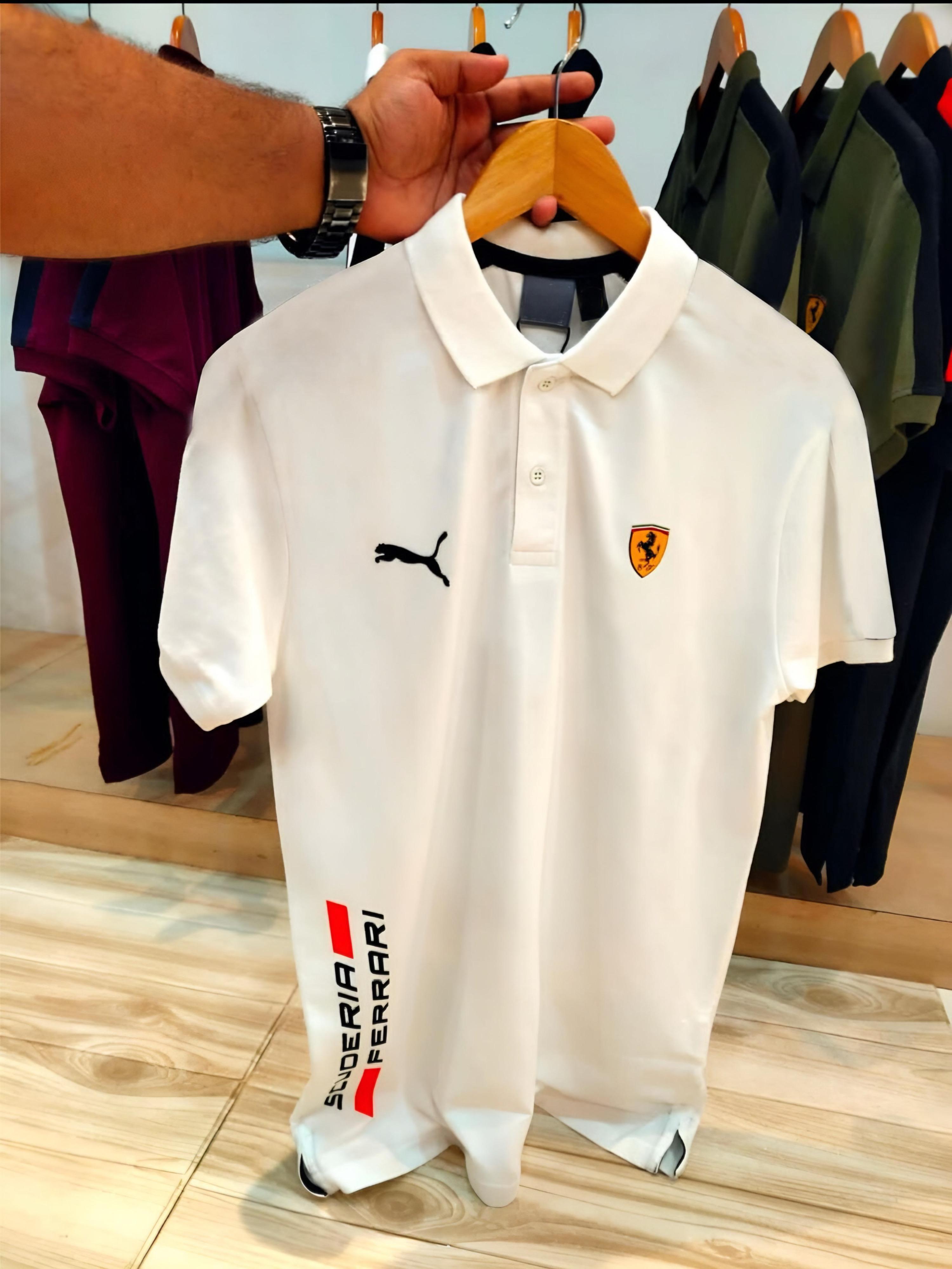 Experience sporty elegance with the Puma Ferrari Premium Matty Cotton Collar T-Shirt for Men. Crafted from 100% SAPP Matty Cotton, this tee combines comfort, durability, and iconic style. Featuring a structured collar, sleek finish, and official Puma x Ferrari branding, it’s designed to give you that effortlessly smart look – whether you're heading out or dressing casual. Choose from 4 bold colors and make every outing a style statement.