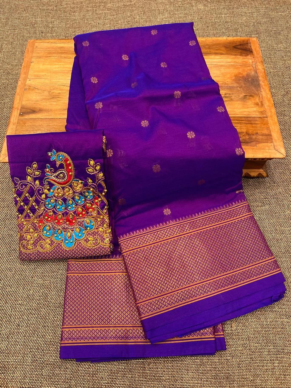 Grace your special occasions with this Traditional Border Kalanjali Paithani Saree, made from soft Tana silk and adorned with all-over buttis, a rich traditional border, and an elegant Aari Work Blouse Piece. Perfect blend of heritage and style for weddings and festive wear.