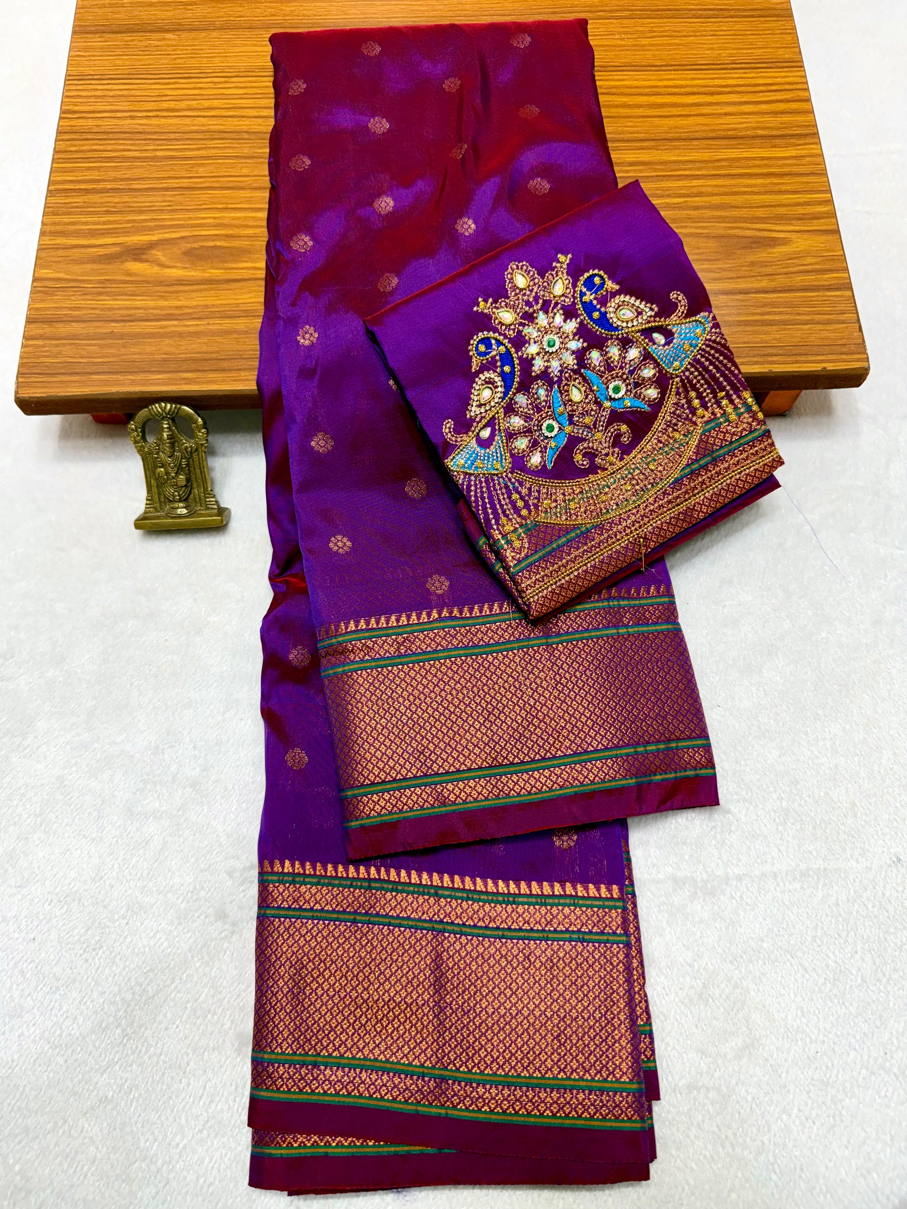 Shop elegant Pure Silk Copy Kalanjali Paithani Sarees featuring all-over butti design, rich pallu, premium Tana silk fabric, and exquisite Aari work blouse piece. Premium quality ethnic wear for weddings, festivals, and special occasions.