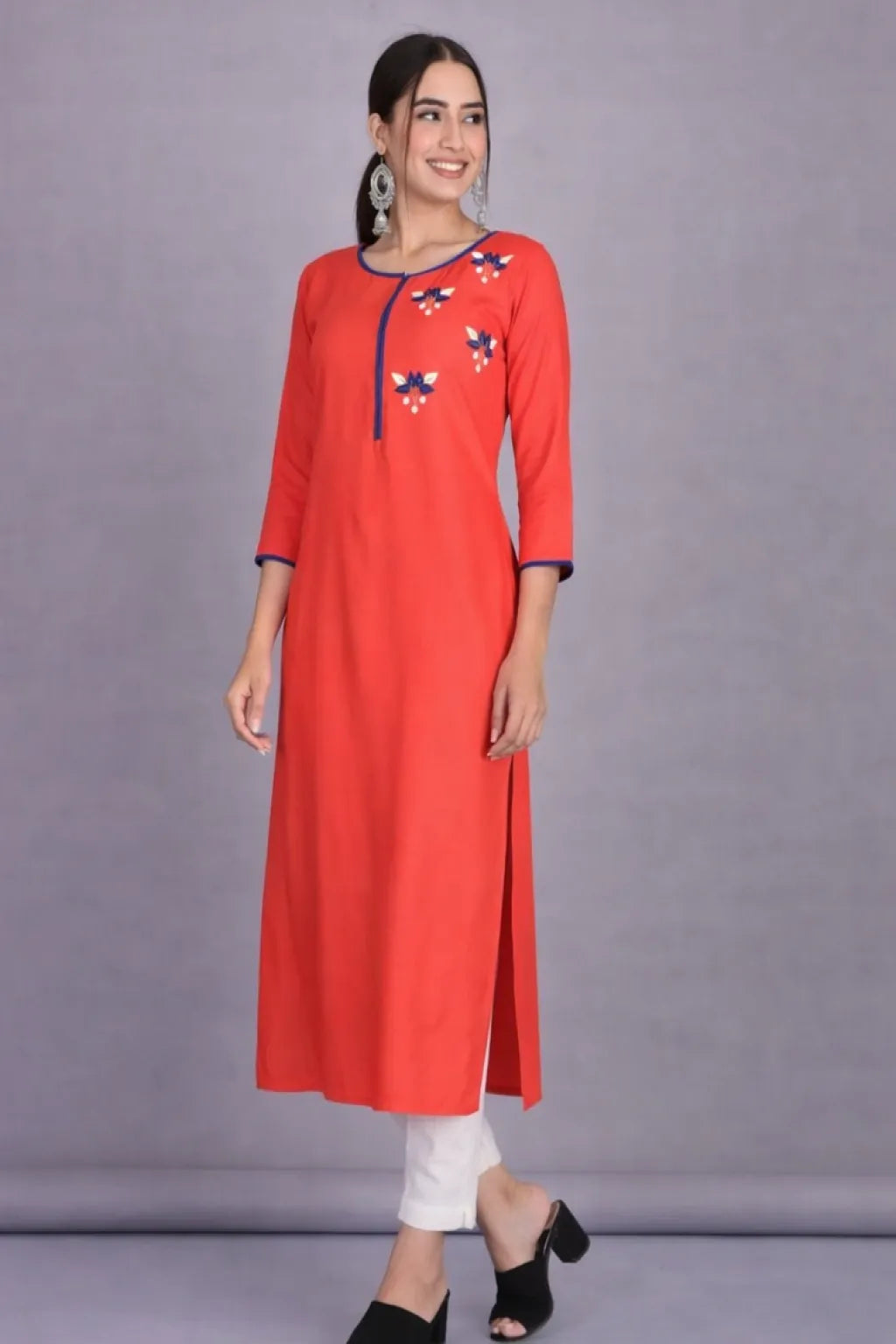 Shop elegant rayon straight cut kurti with hand embroidered floral motifs in red and blue. Comfortable ethnic wear for women available in M to 3XL.