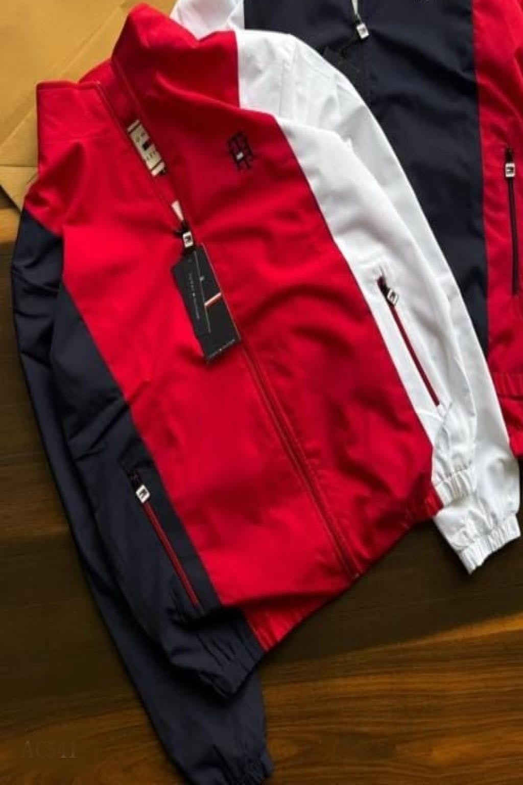 stylish embroidery detailing and both-side zip pockets, this windcheater offers a perfect blend of functionality and premium design. The soft net lining inside enhances comfort, making it ideal for daily wear, travel, or outdoor activities.
