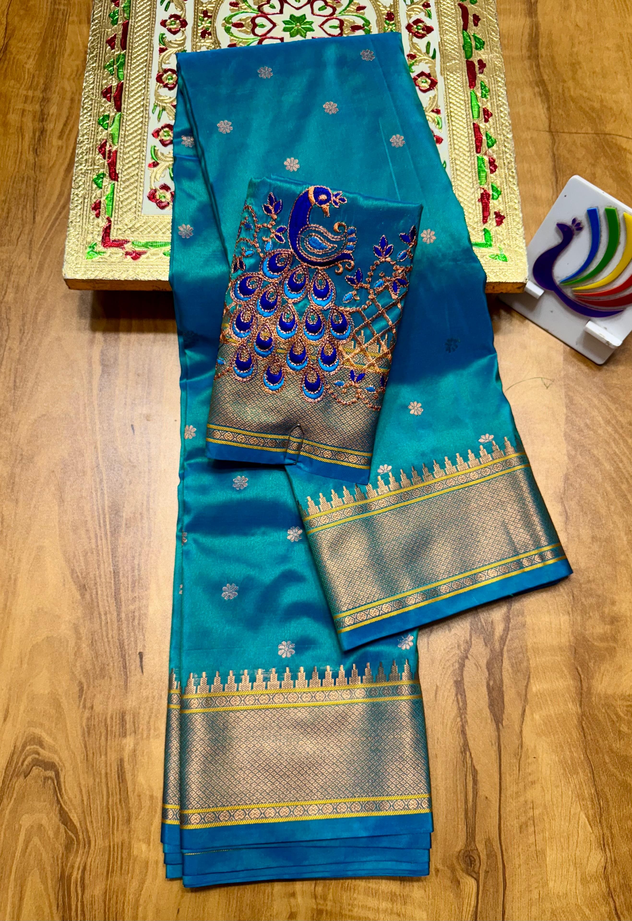 Discover the richness of tradition with our New Launching Kalanjali Bindiya Paithani Saree, a timeless creation woven in premium soft; shiny Tana silk. Designed with all-over buttis, a rich intricately styled pallu, and a copper zari border small temple, this saree reflects true craftsmanship and cultural heritage.