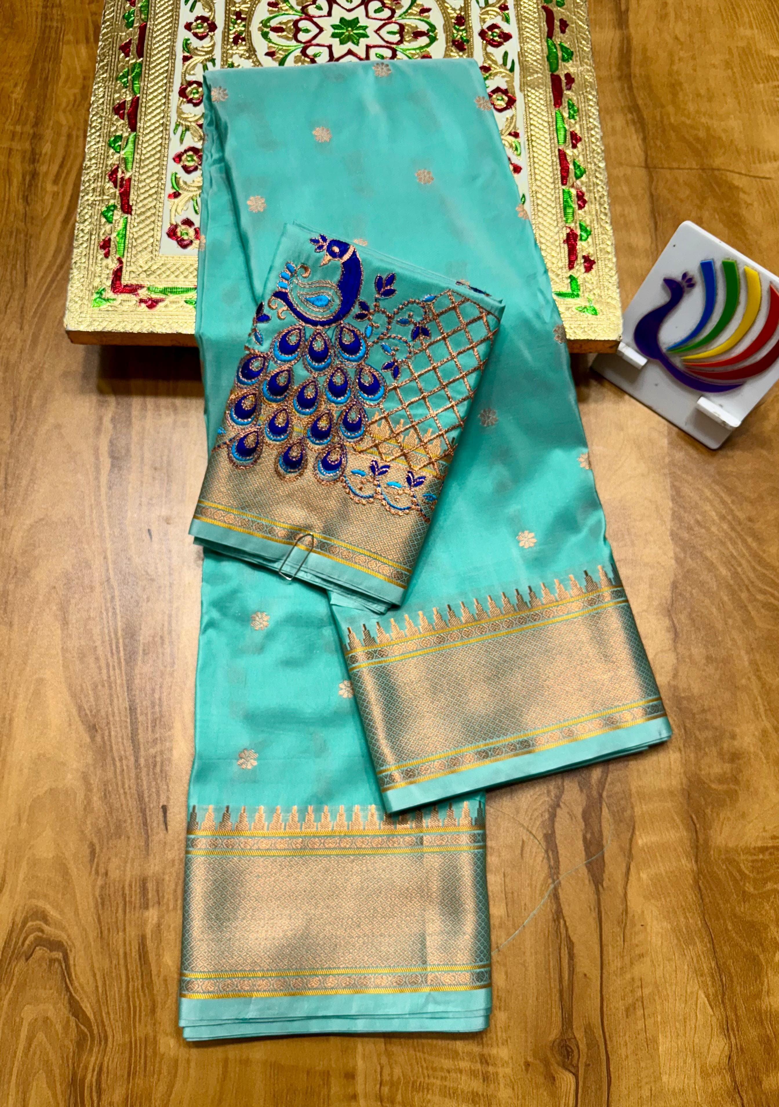 Discover the richness of tradition with our New Launching Kalanjali Bindiya Paithani Saree, a timeless creation woven in premium soft &amp; shiny Tana silk. Designed with all-over buttis, a rich intricately styled pallu, and a copper zari border small temple, this saree reflects true craftsmanship and cultural heritage.