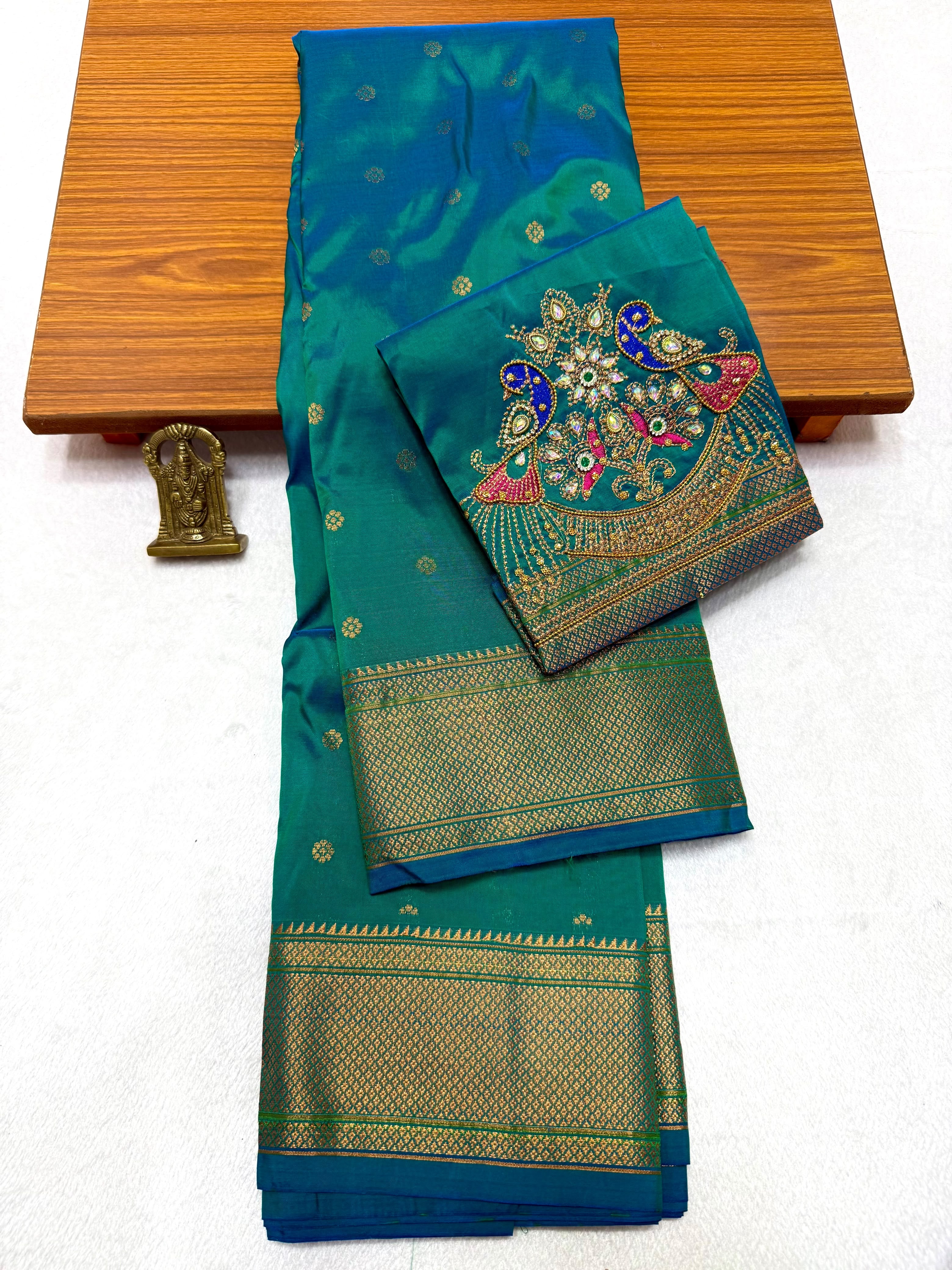 Shop elegant Pure Silk Copy Kalanjali Paithani Sarees featuring all-over butti design, rich pallu, premium Tana silk fabric, and exquisite Aari work blouse piece. Premium quality ethnic wear for weddings, festivals, and special occasions.