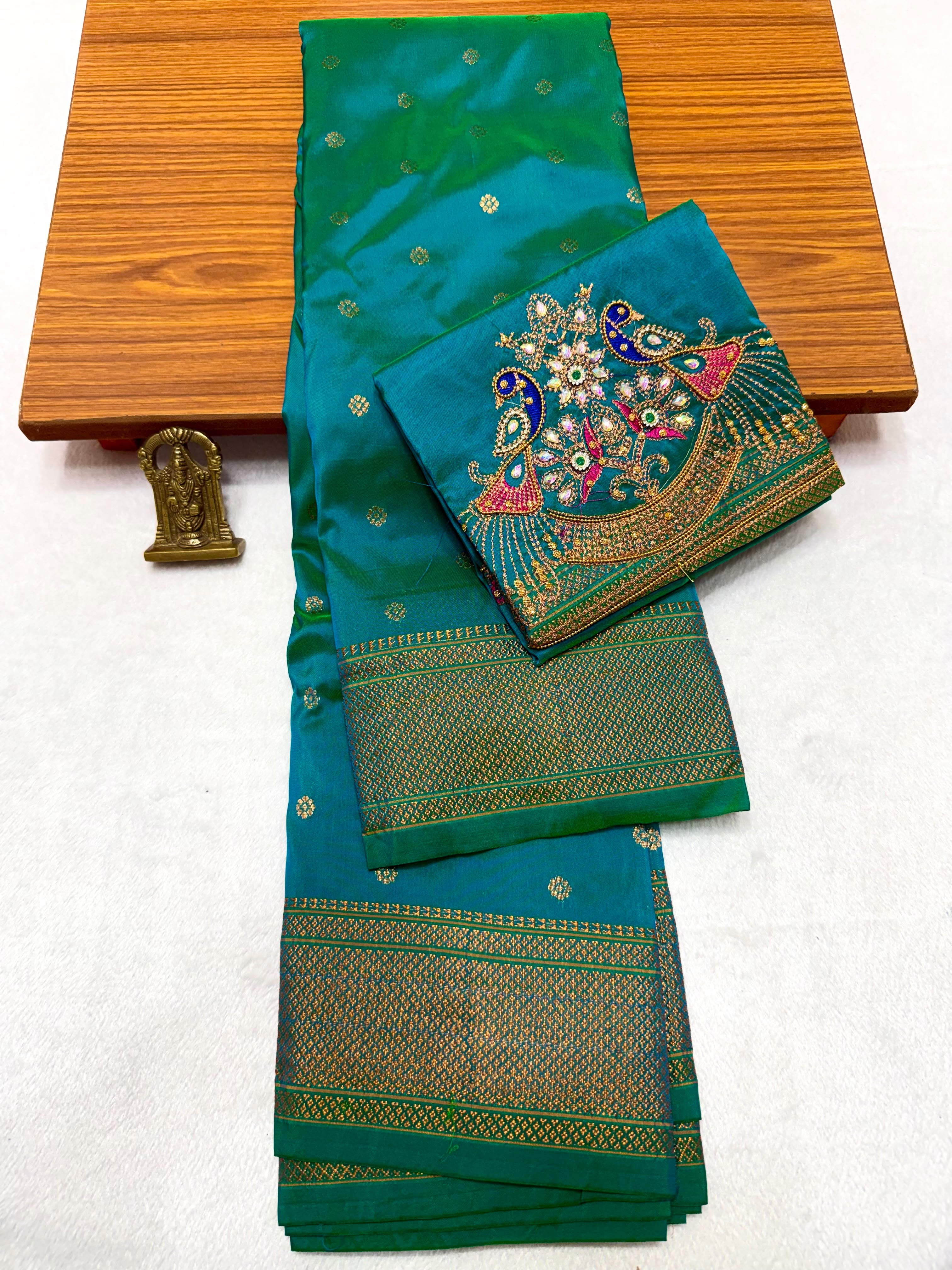 Shop elegant Pure Silk Copy Kalanjali Paithani Sarees featuring all-over butti design, rich pallu, premium Tana silk fabric, and exquisite Aari work blouse piece. Premium quality ethnic wear for weddings, festivals, and special occasions.