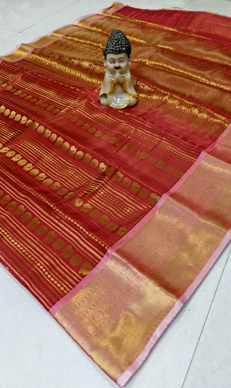 Step into elegance with our Vaira Oosi Saree, crafted to give a rich and graceful traditional look. The beautiful red base with golden zari weaving makes it perfect for all special occasions.