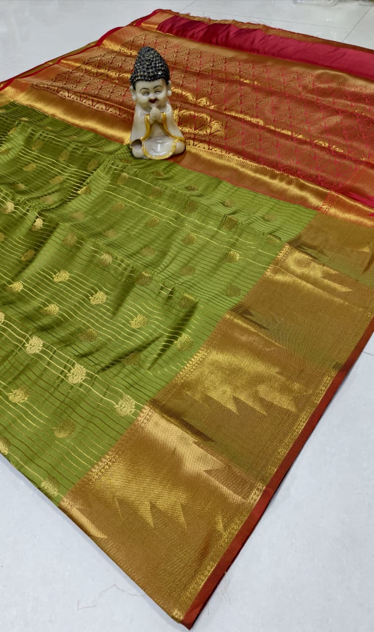 Step into elegance with our Vaira Oosi Saree, crafted to give a rich and graceful traditional look. The beautiful red base with golden zari weaving makes it perfect for all special occasions.