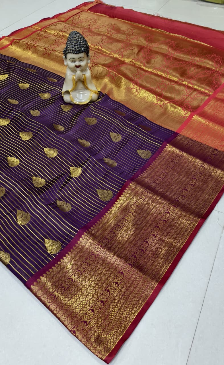 Step into elegance with our Vaira Oosi Saree, crafted to give a rich and graceful traditional look. The beautiful red base with golden zari weaving makes it perfect for all special occasions.