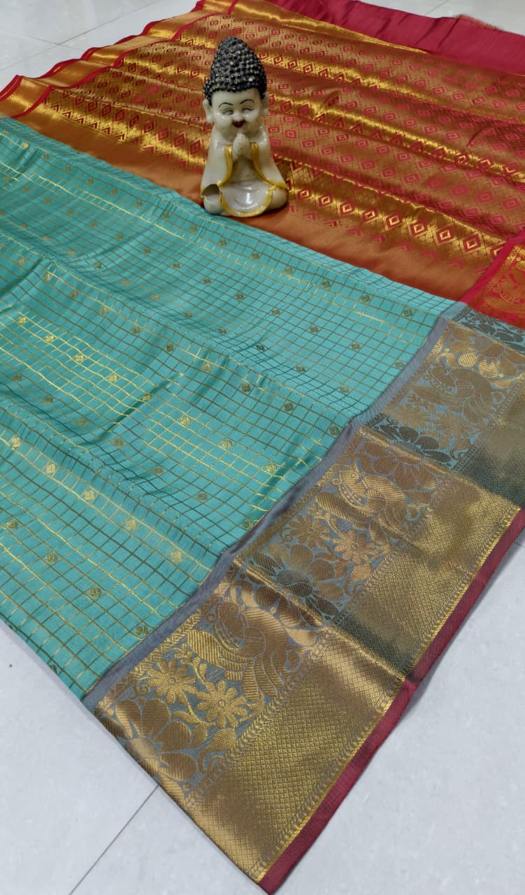 Step into elegance with our Vaira Oosi Saree, crafted to give a rich and graceful traditional look. The beautiful red base with golden zari weaving makes it perfect for all special occasions.