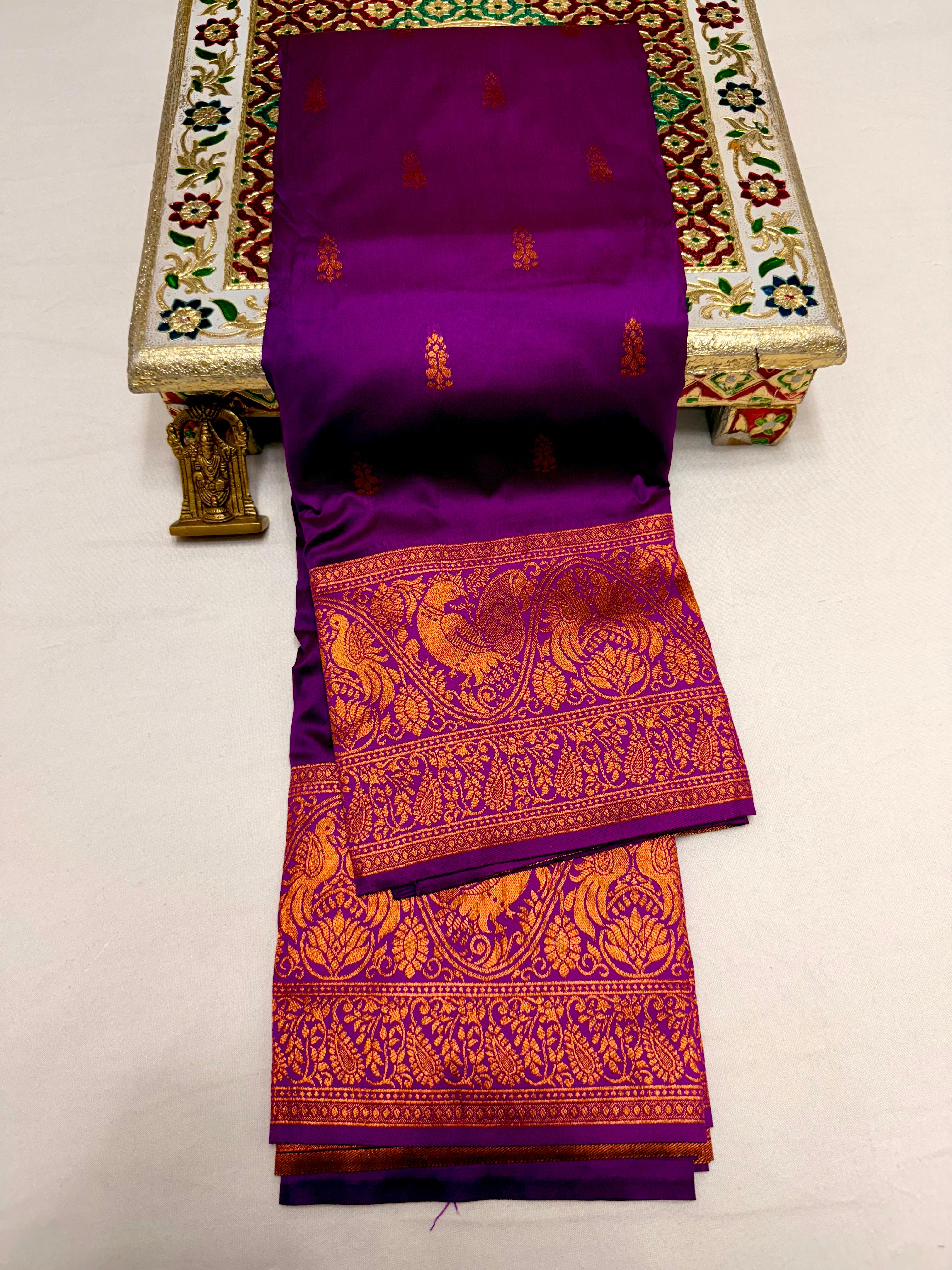 Elevate your ethnic wardrobe with this Mahalaxmi Kanjivaram Paithani Saree, crafted from Pure Soft Silk with rich all-over buttis, a grand pallu, and matching running blouse piece — perfect for festivals and weddings.