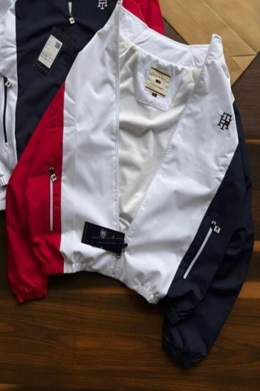 stylish embroidery detailing and both-side zip pockets, this windcheater offers a perfect blend of functionality and premium design. The soft net lining inside enhances comfort, making it ideal for daily wear, travel, or outdoor activities.