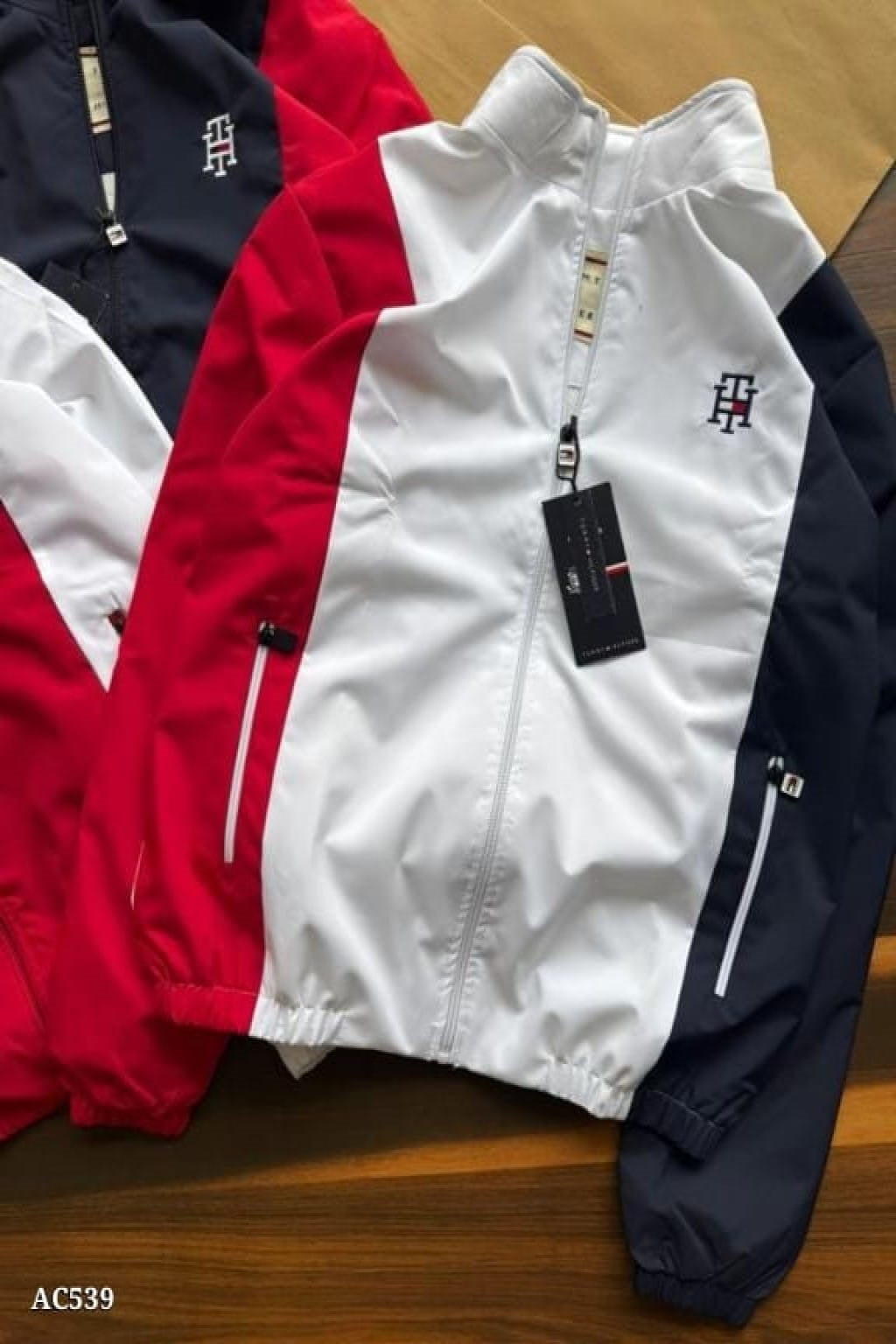 stylish embroidery detailing and both-side zip pockets, this windcheater offers a perfect blend of functionality and premium design. The soft net lining inside enhances comfort, making it ideal for daily wear, travel, or outdoor activities.