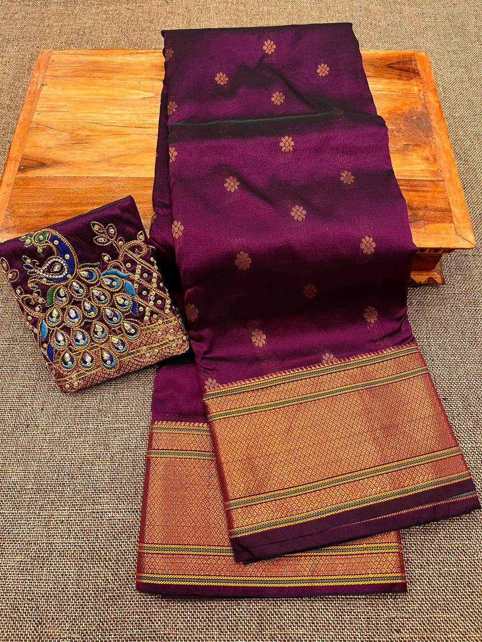 Grace your special occasions with this Traditional Border Kalanjali Paithani Saree, made from soft Tana silk and adorned with all-over buttis, a rich traditional border, and an elegant Aari Work Blouse Piece. Perfect blend of heritage and style for weddings and festive wear.