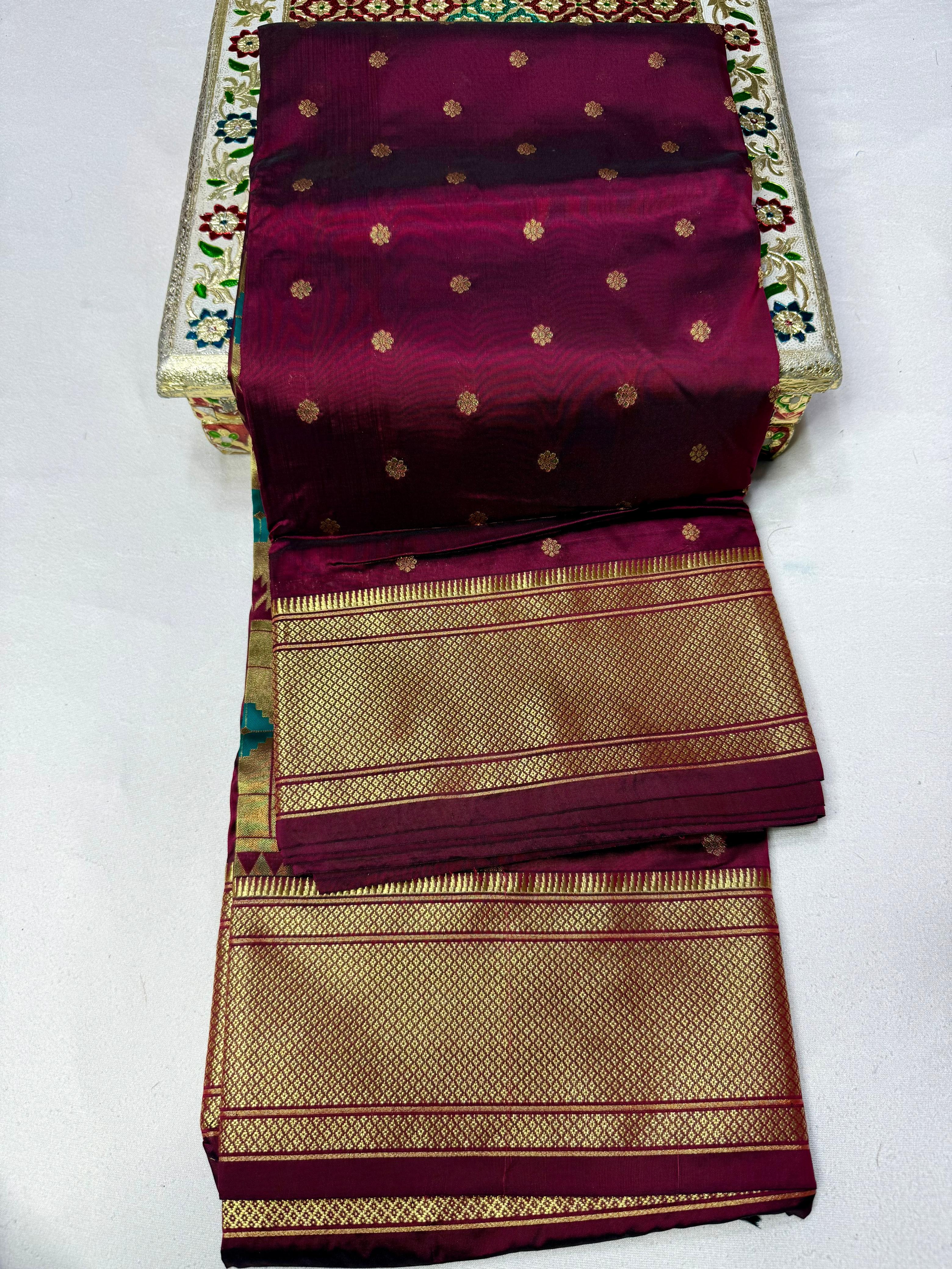 Traditional Tana Silk Kalanjali Paithani with rich Maharani pallu, crafted in premium pure soft silk. Featuring all-over Karnfuli butti, classic traditional border, and running blouse piece. A viral trending Paithani saree perfect for weddings, festivals, and special occasions.