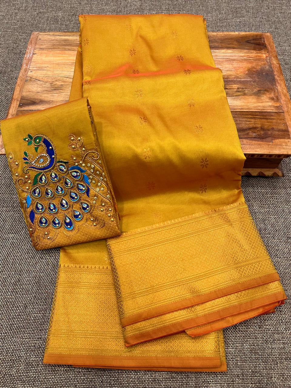 Grace your special occasions with this Traditional Border Kalanjali Paithani Saree, made from soft Tana silk and adorned with all-over buttis, a rich traditional border, and an elegant Aari Work Blouse Piece. Perfect blend of heritage and style for weddings and festive wear.