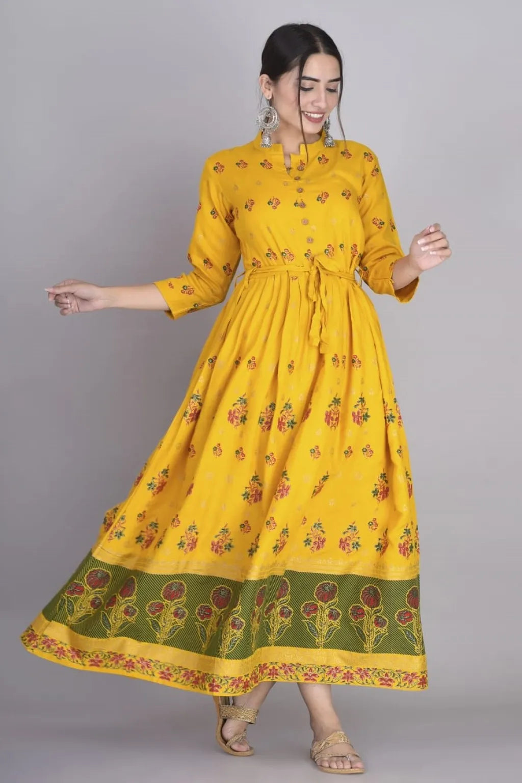 Discover the intricate design and superior quality of our Anarkali Dress-Long Gown kurti. Made from soft and durable Rayon, this dress features a pleted waist for a flattering fit