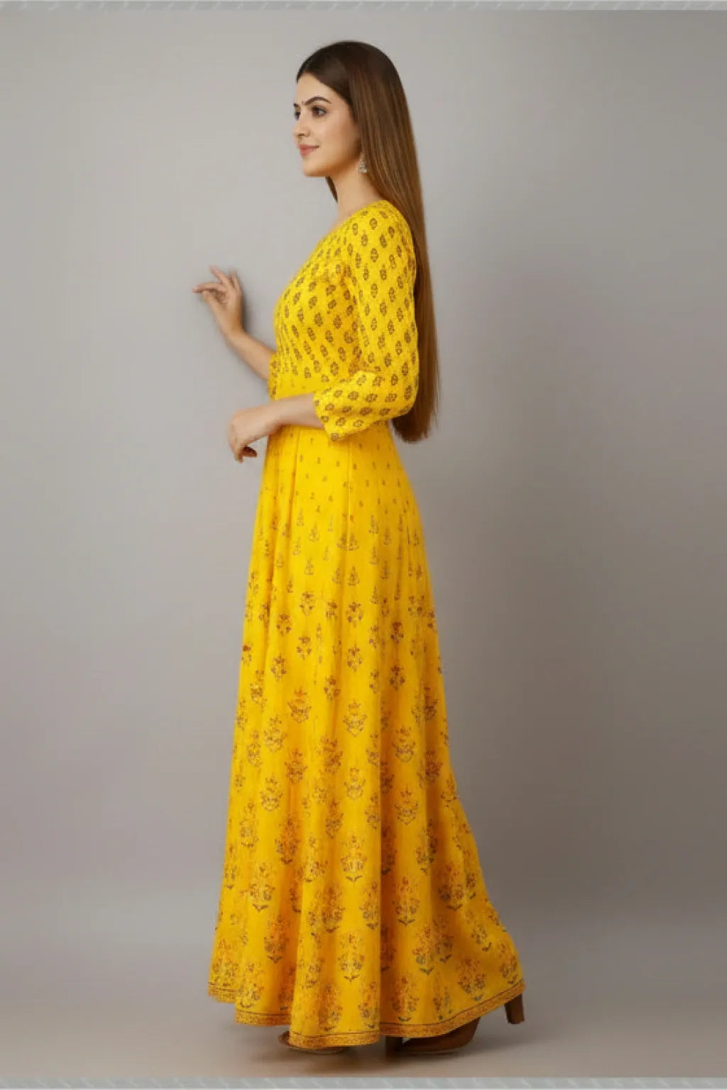 This Long Gown features a flared design and vibrant yellow color with a stunning printed design, perfect for any occasion. Made for women, this gown offers both style and comfort. With its flared silhouette and eye-catching print, this gown is sure to make a statement.