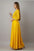 This Long Gown features a flared design and vibrant yellow color with a stunning printed design, perfect for any occasion. Made for women, this gown offers both style and comfort. With its flared silhouette and eye-catching print, this gown is sure to make a statement.