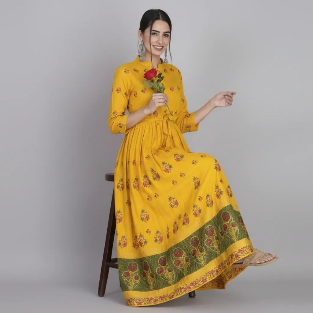 Discover the intricate design and superior quality of our Anarkali Dress-Long Gown kurti. Made from soft and durable Rayon, this dress features a pleted waist for a flattering fit