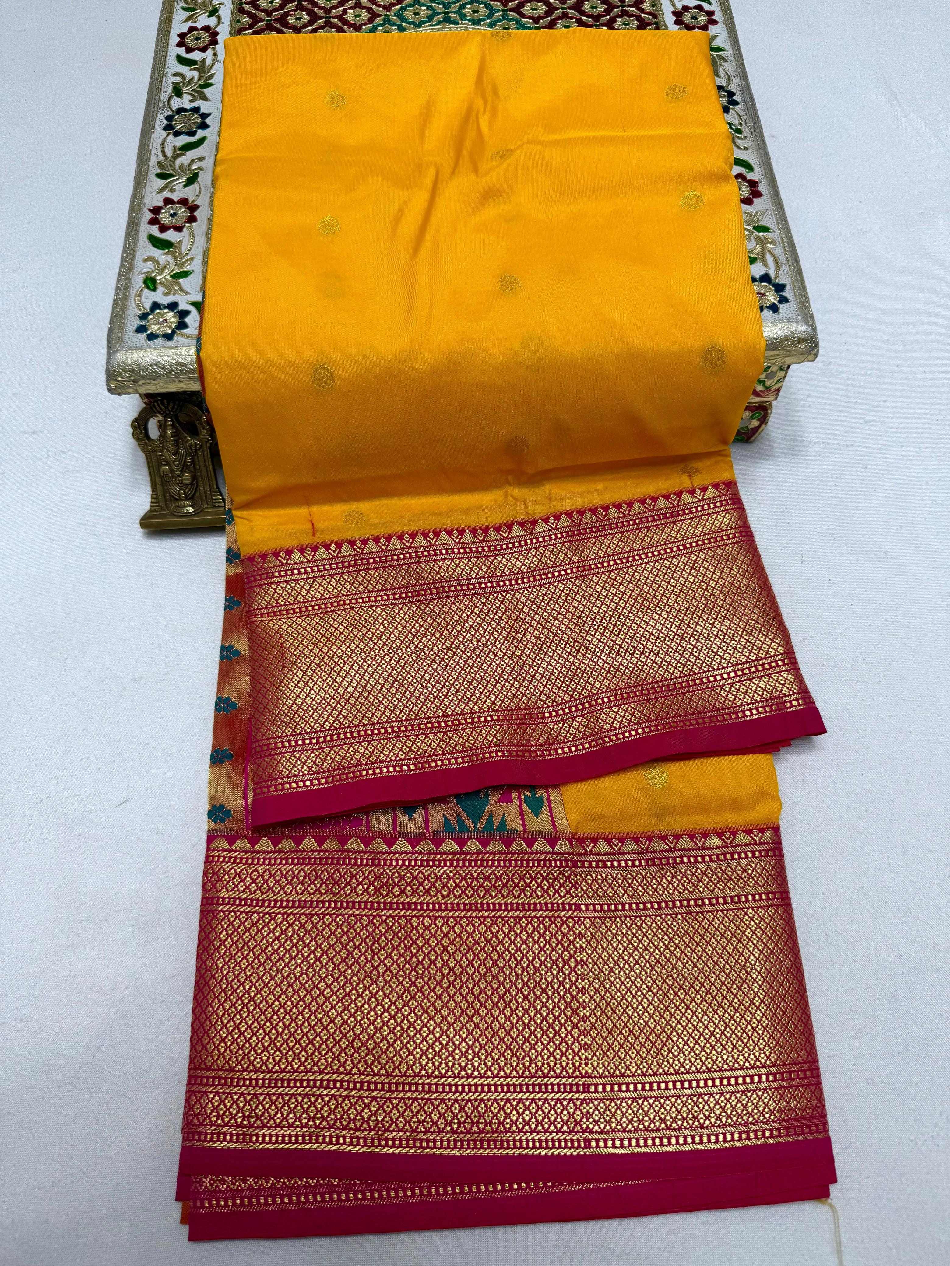 Step into timeless elegance with our Premium Copy of Pure Silk Yeola Kadiyal Paithani Saree, featuring exquisite 4x4 handmade Paithani Pallu and all-over intricate buttis that embody true artistry.