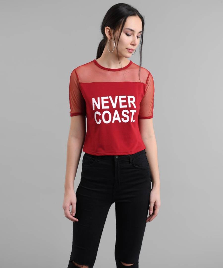 Maroon Never Coast Print Top With Net Yoke.&nbsp;This maroon top features a unique Never Coast print with a delicate net yoke. The perfect blend of style and comfort, this top is perfect for any occasion. The intricate design and high-quality materials make it a must-have for your wardrobe. Elevate your look with this versatile piece.