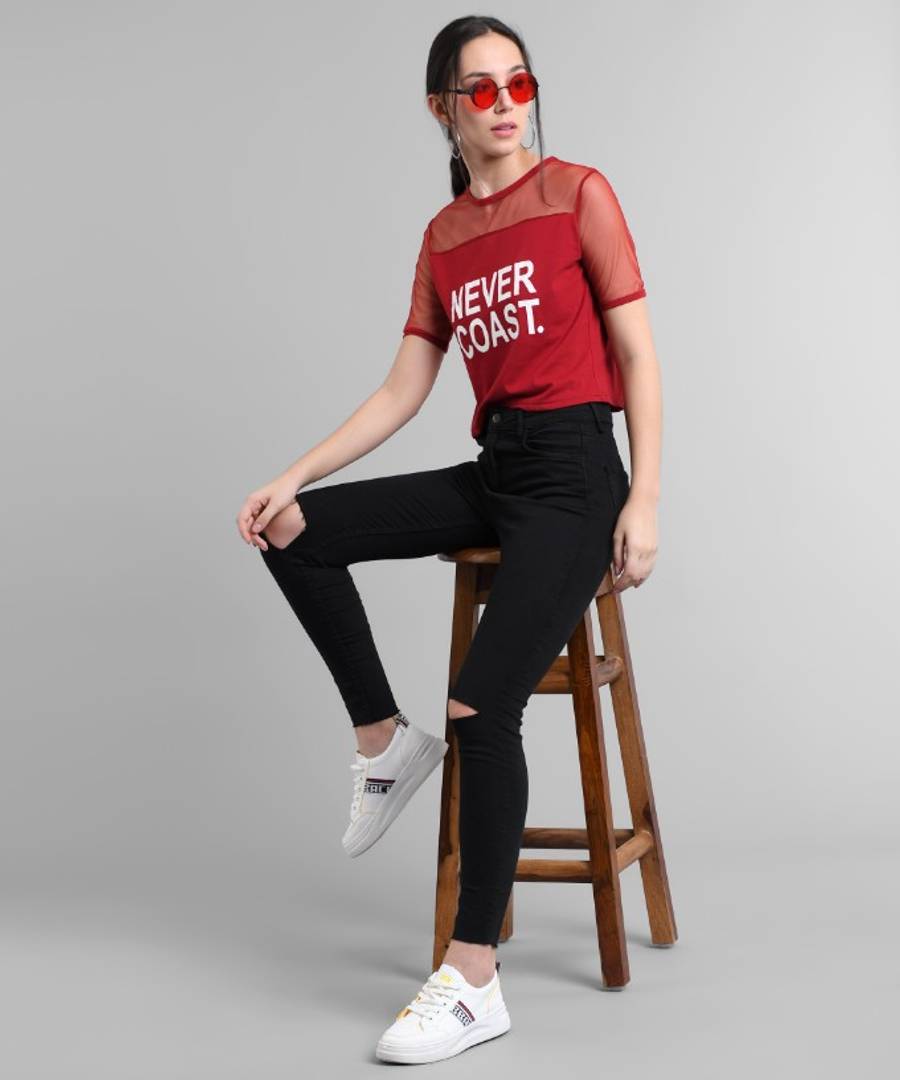 Maroon Never Coast Print Top With Net Yoke.&nbsp;This maroon top features a unique Never Coast print with a delicate net yoke. The perfect blend of style and comfort, this top is perfect for any occasion. The intricate design and high-quality materials make it a must-have for your wardrobe. Elevate your look with this versatile piece.