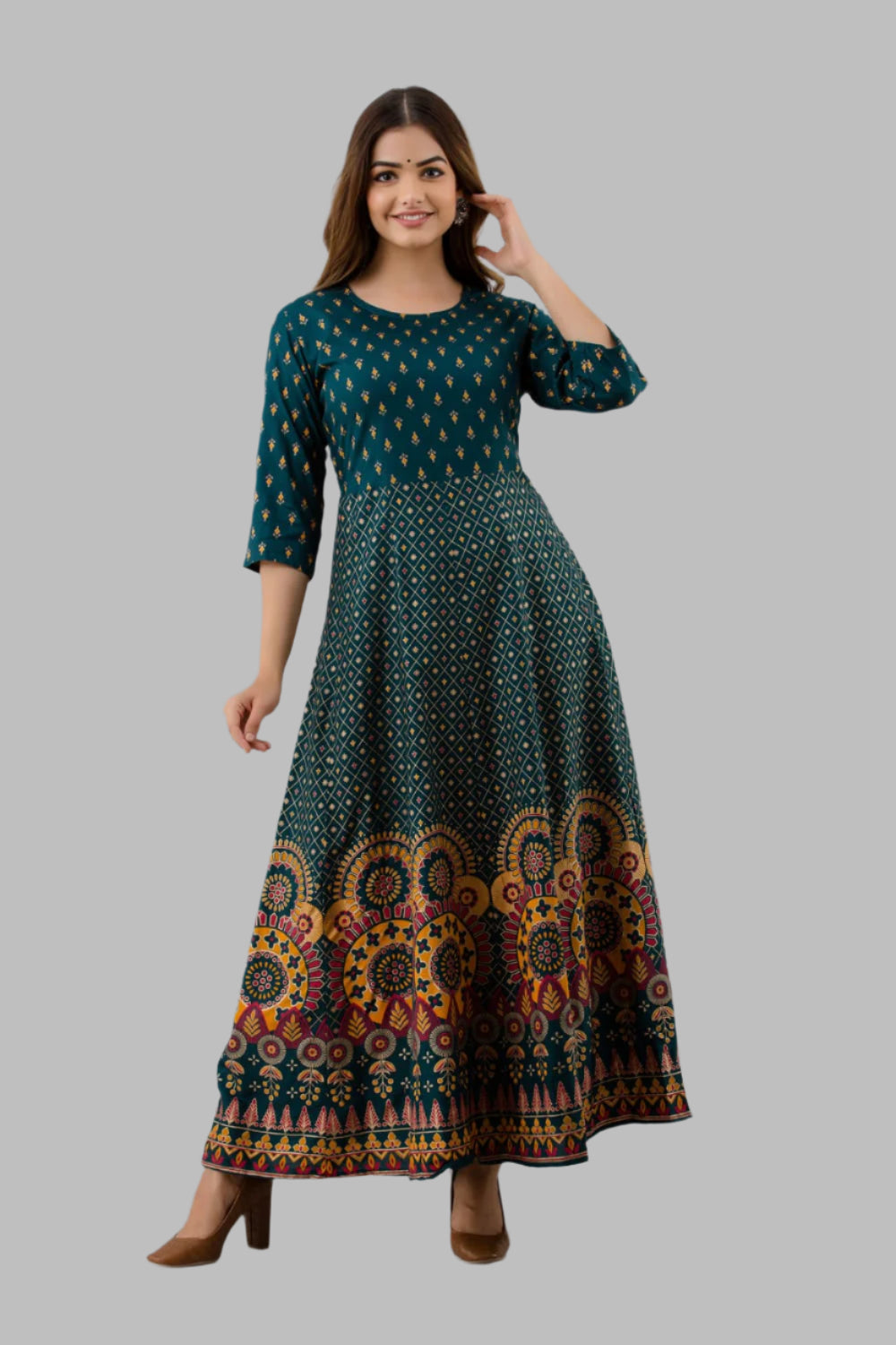 Elevate your wardrobe with this elegant Women’s Long Gown Green Kurti crafted from soft, breathable rayon. Featuring a refined design, it combines comfort with style